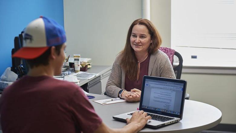 Academic adviser talking to student